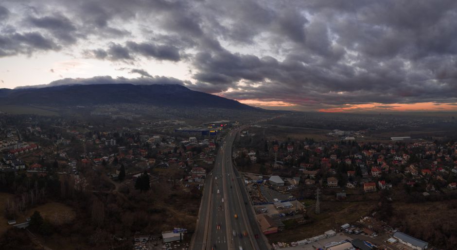 Segurança Pública São Paulo. — Aerial photograph of Sofia, Bulgaria with a highway, cityscape, and dramatic cloudy sky at